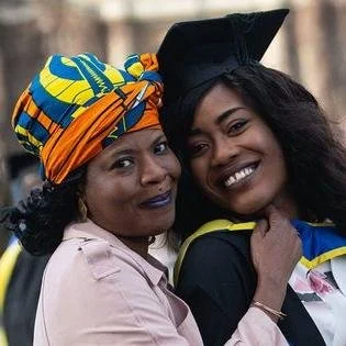 Graduate celebrating with family